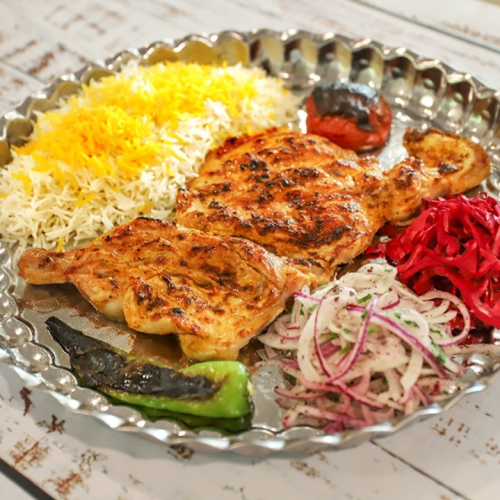 Halbes gegrilltes Huhn mit Beilage